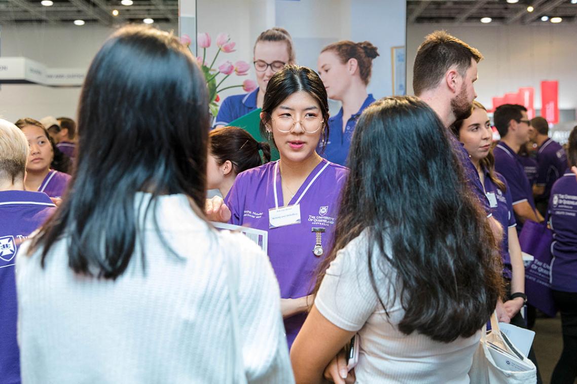 Attendees listen to a UQ representative at TSXPO